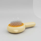 Dog grooming brush for managing loose and shedding hair